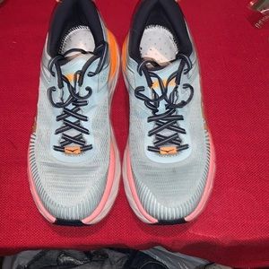 Women HOKA gray and orange shoes